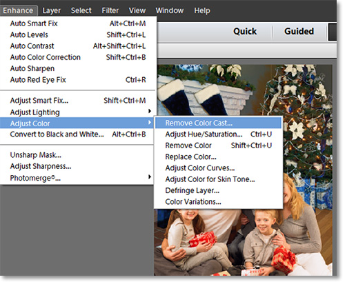 Use the Remove Color Cast function in Photoshop Elements.